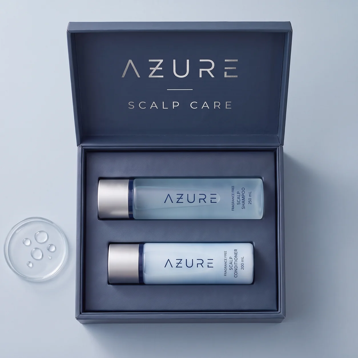Open navy AZURE presentation box with the Scalp Shampoo and Scalp Conditioner