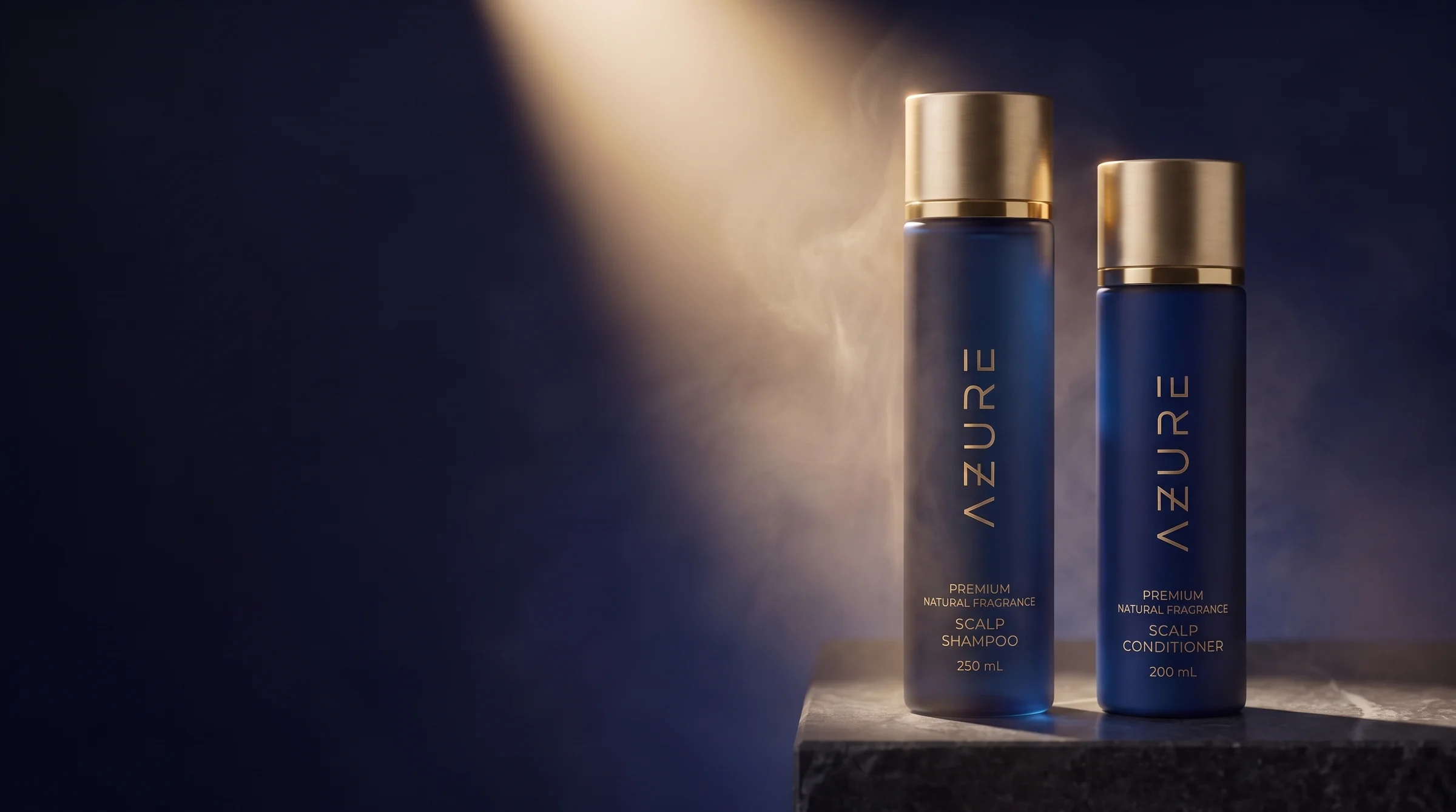 AZURE Premium shampoo and conditioner, midnight-navy bottles with gold caps, on dark stone in a beam of warm light